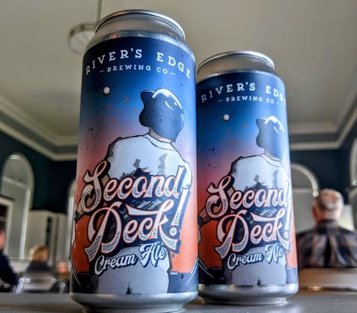 Two cans of Second Deck cream ale, in the Community Room. 