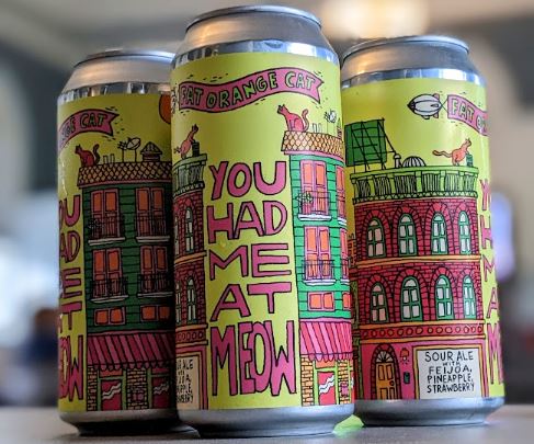 Cans of You Had Me At Meow in the Community Room. 