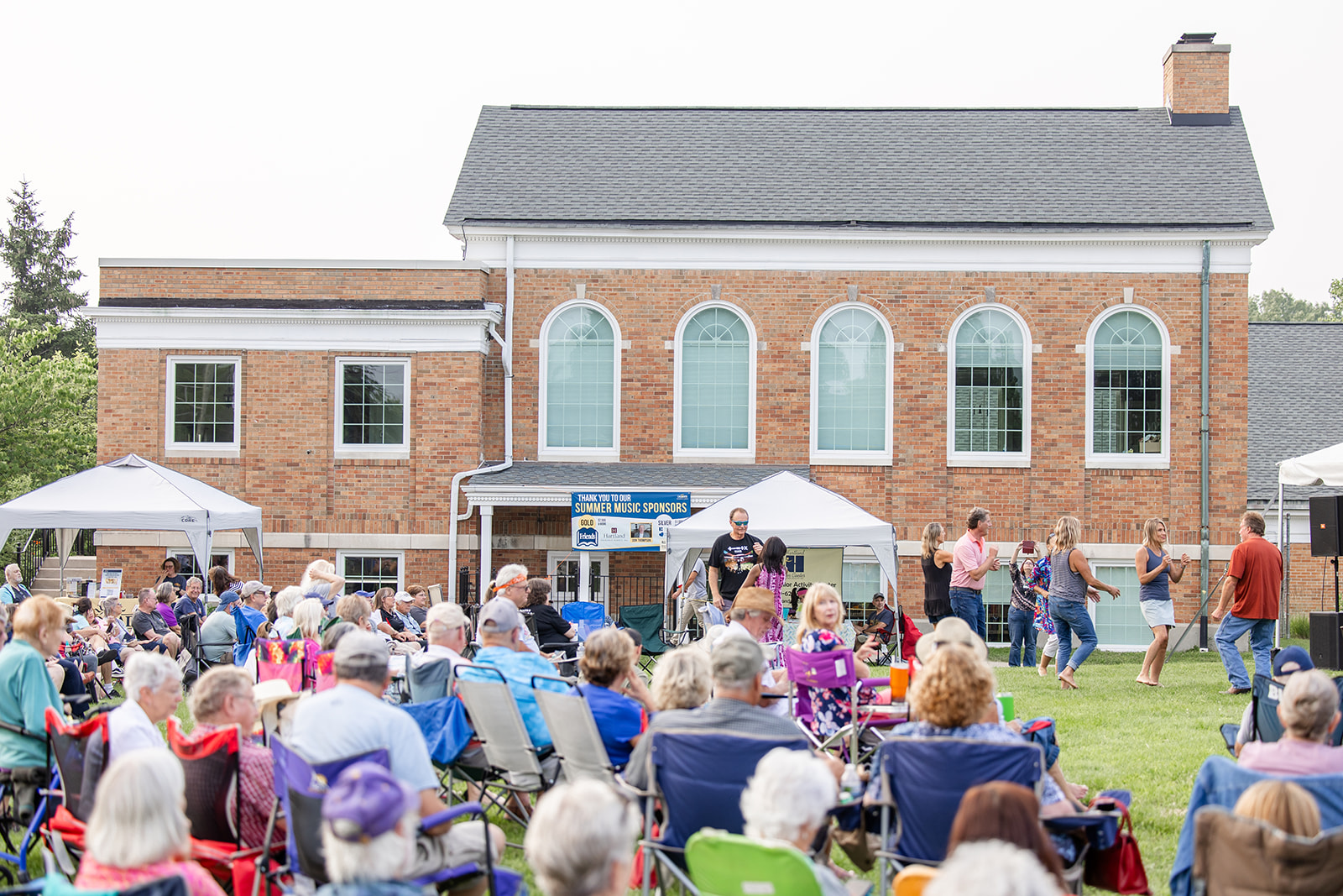 Photo of a crowd outside Cromaine Library's brick building.