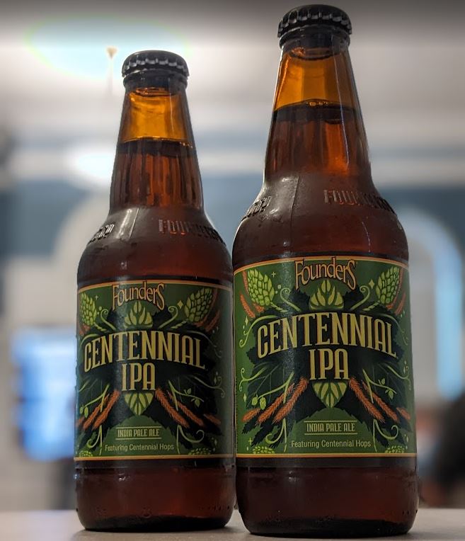 Two bottles of Centennial IPA in the Community Room, during an Ale Together Now program. 