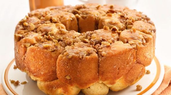 A round loaf of monkey bread on a plate. 