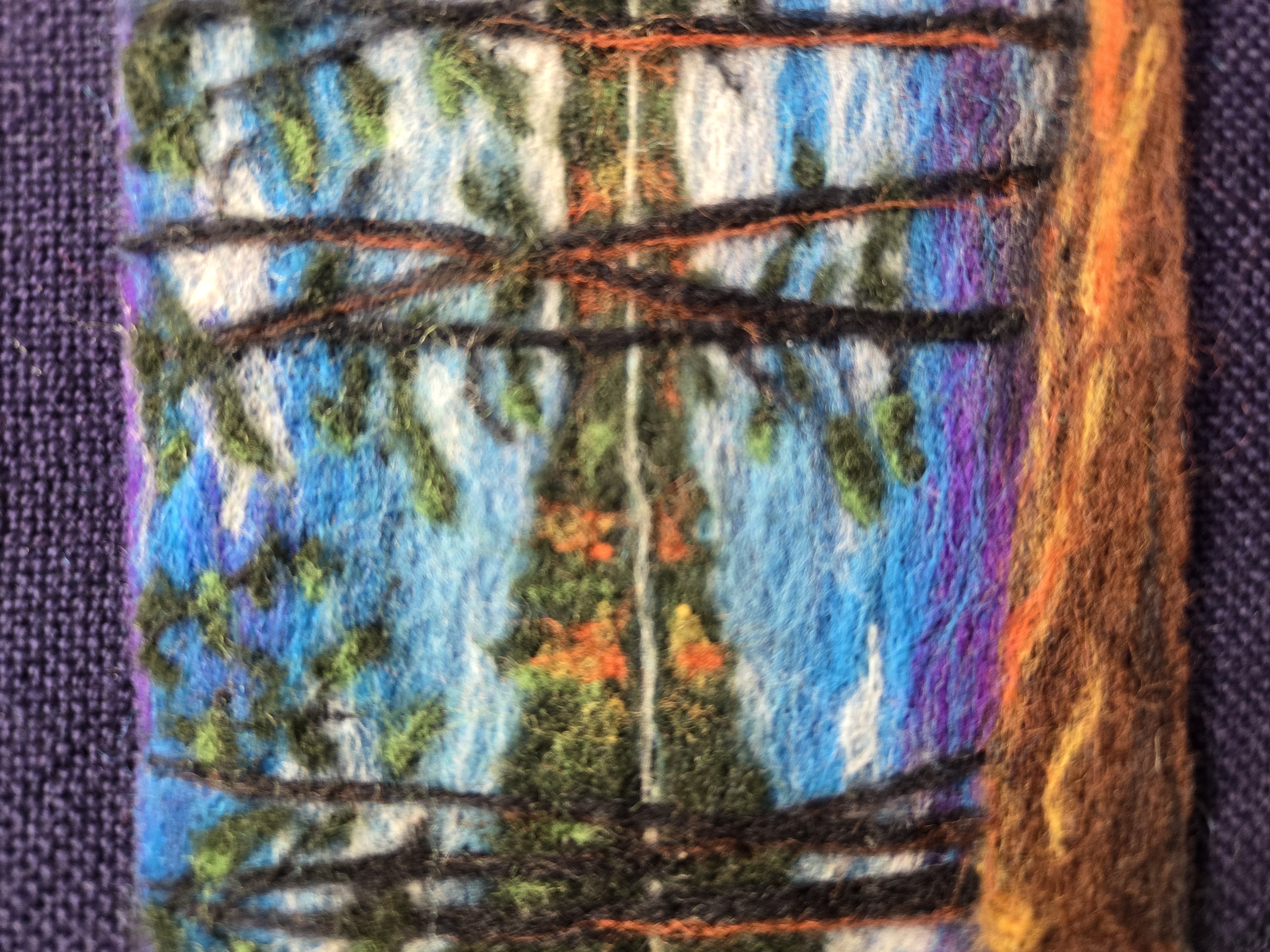A calm fall scene to represent Waldenwoods was created from needle felted wool.
