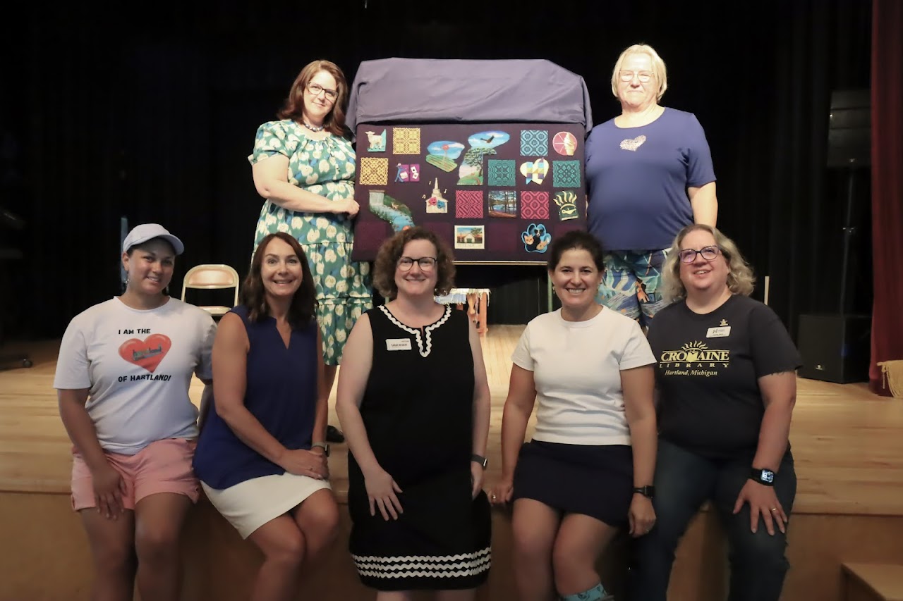 Members of the Hartland Art Walk committee, with local artists, at the Music Hall stage with the commissioned art piece. 