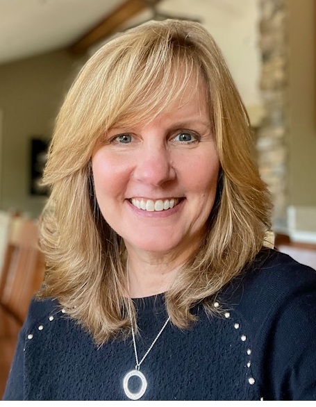 Artist Cindy Shinabarker smiles at camera.