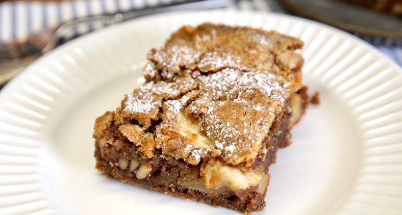 Apple cake on a white plate. 