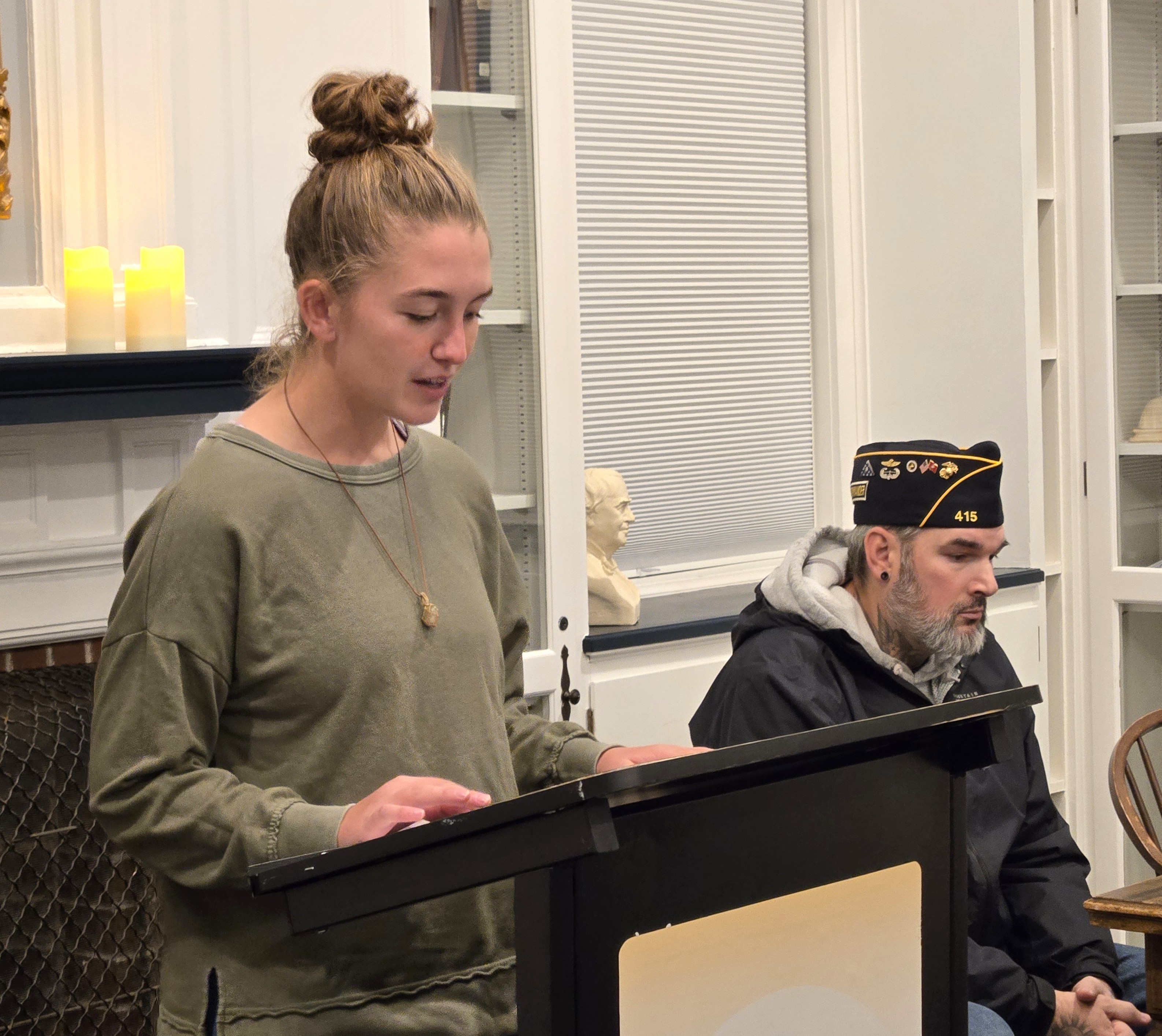 Sylvia Rogers reads her essay aloud in the Community Room. 