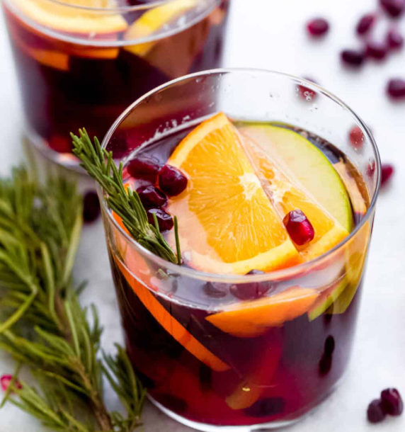Sangria with lots of fruits and herbs. 