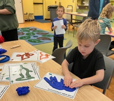 A child working on a craft during a Get Ready for Kindergarten program. 