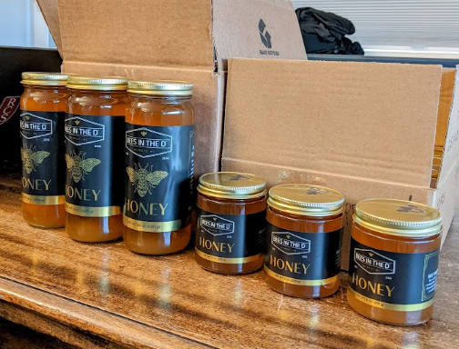 Jars of honey from our Bees in the D program. 