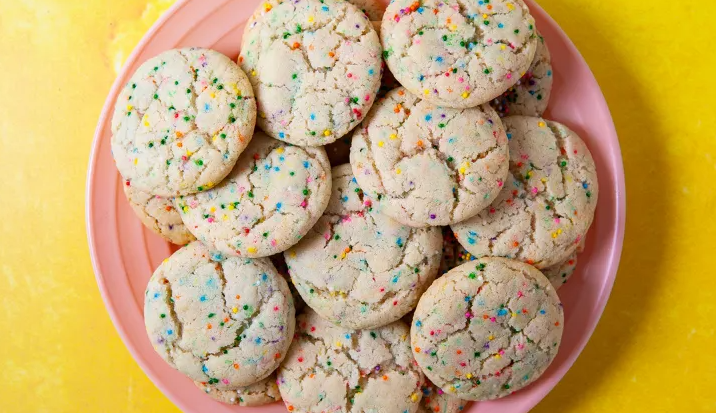 Funfetti cookies on a pink plate. 
