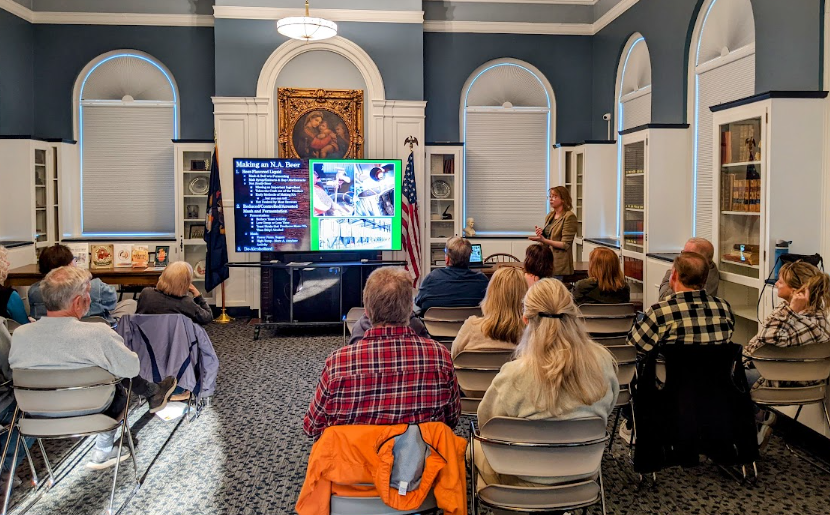 Michelle lecturing our Ale Together Now program in the Community Room. 