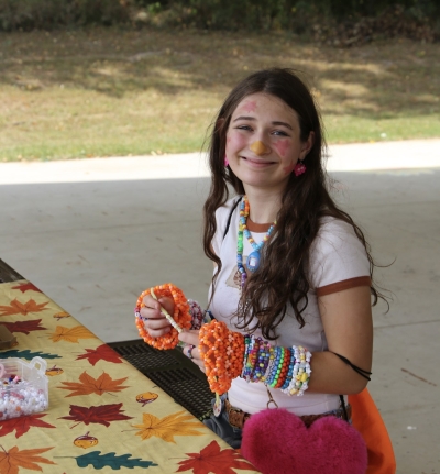 A volunteer crafting during the first weekend of Art Walk, 2025. 