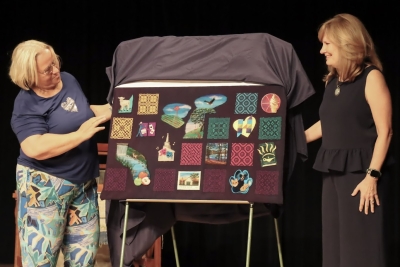 Artists Gisela and Cindy unveil their woven art piece for Art Walk 2025. 