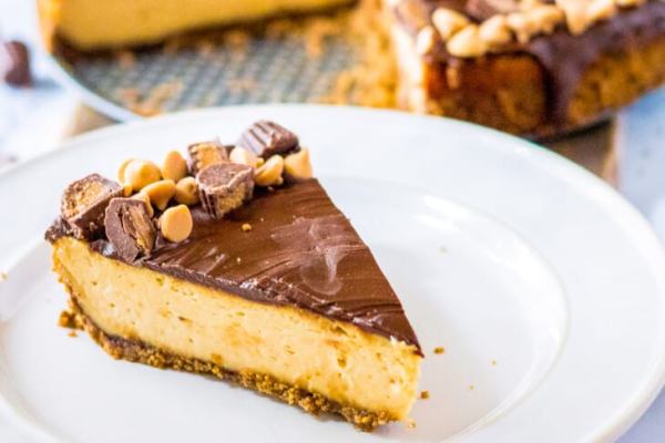 Peanut butter cup cheesecake on a white plate. 