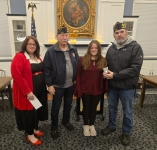 Gold winner of the Grant Sweet Memorial Essay Contest with local veterans and Library staff in the Community Room. 