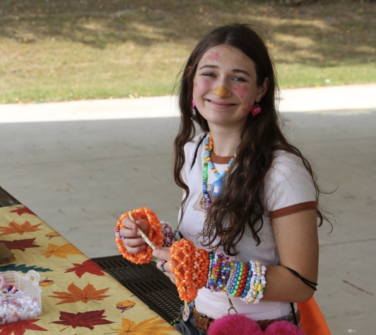 A volunteer crafting during the first weekend of Art Walk, 2025. 