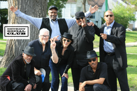 Detroit Social Club band posing together. 