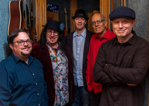 Motown Eagles band posing together.