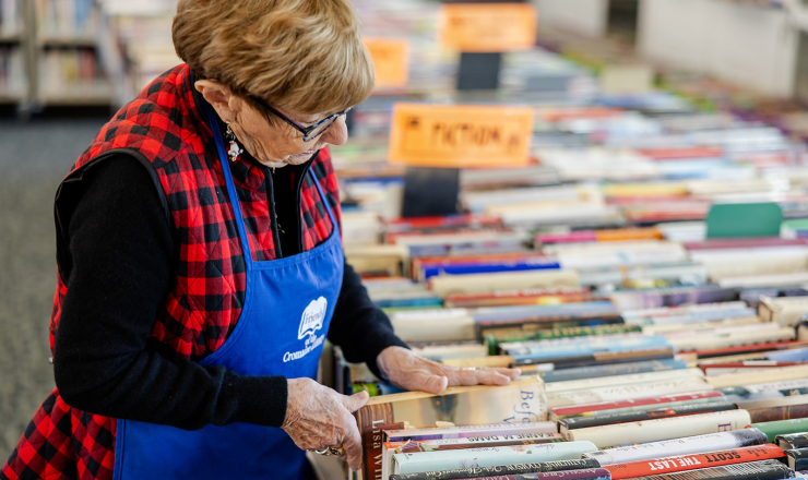 Volunteer Marylynn working the Friends book sale