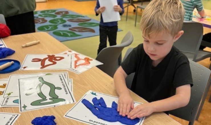 A child working on a craft during a Get Ready for Kindergarten program. 